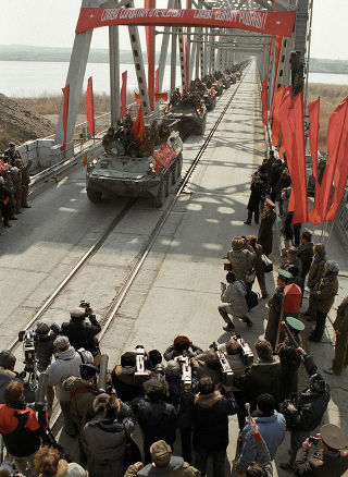 The last Soviet forces leave Afghanistan via Friendship Bridge in February of 1989.