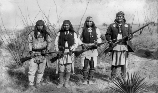 Apache leader Geronimo poses with his warriors.