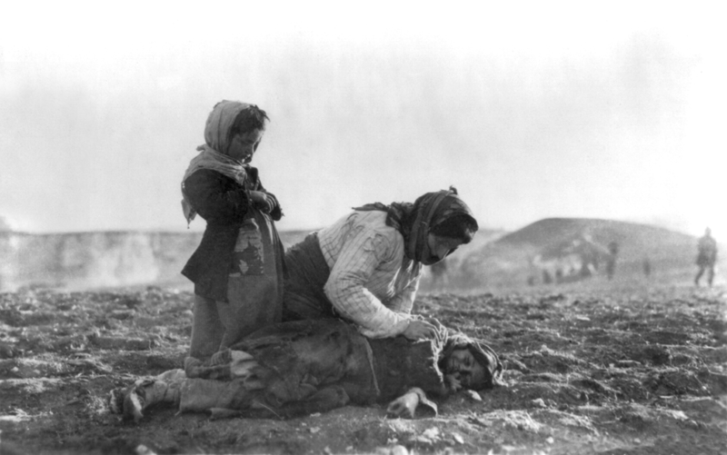 An Armenian woman leans over her dead child near Aleppo, Syria.