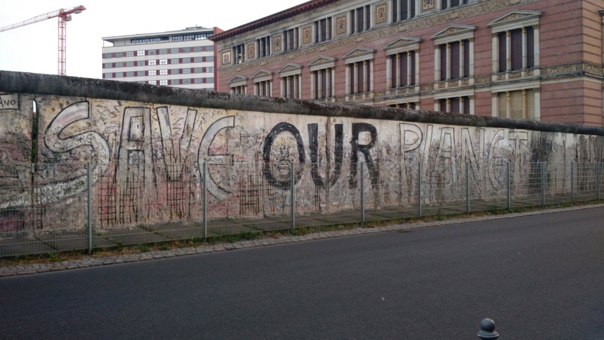 A message of universal peace displayed on a portion of the Berlin Wall.