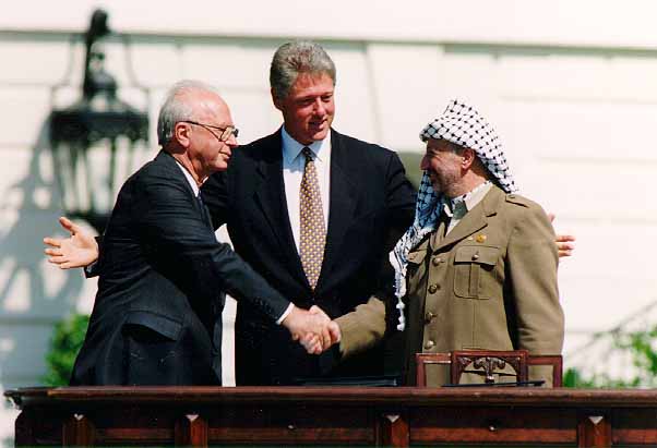 Israeli Prime Minister Yitzhak Rabin, U.S. President Bill Clinton, and Palestinian leader Yasser Arafat.