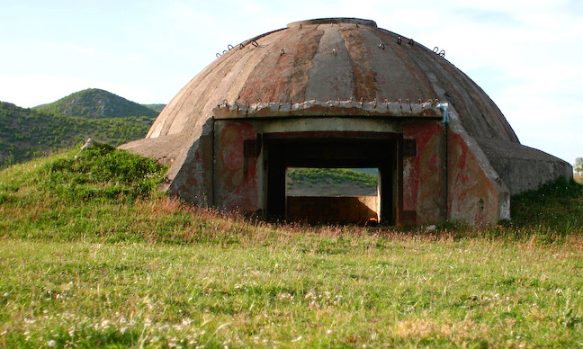 An example of one of the many abandoned bunkers around Albania.