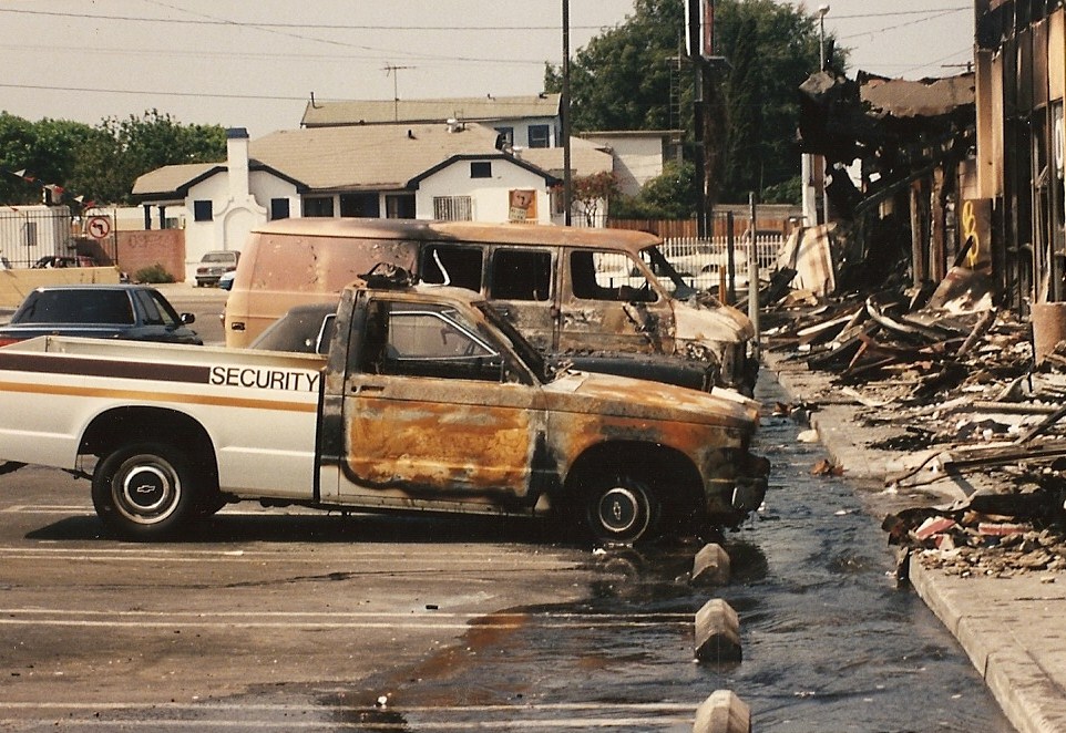 Destroyed cars and store fronts, 1992.