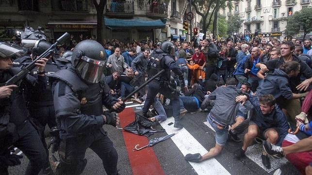 Nationalist police forces in Barcelona preventing voting.
