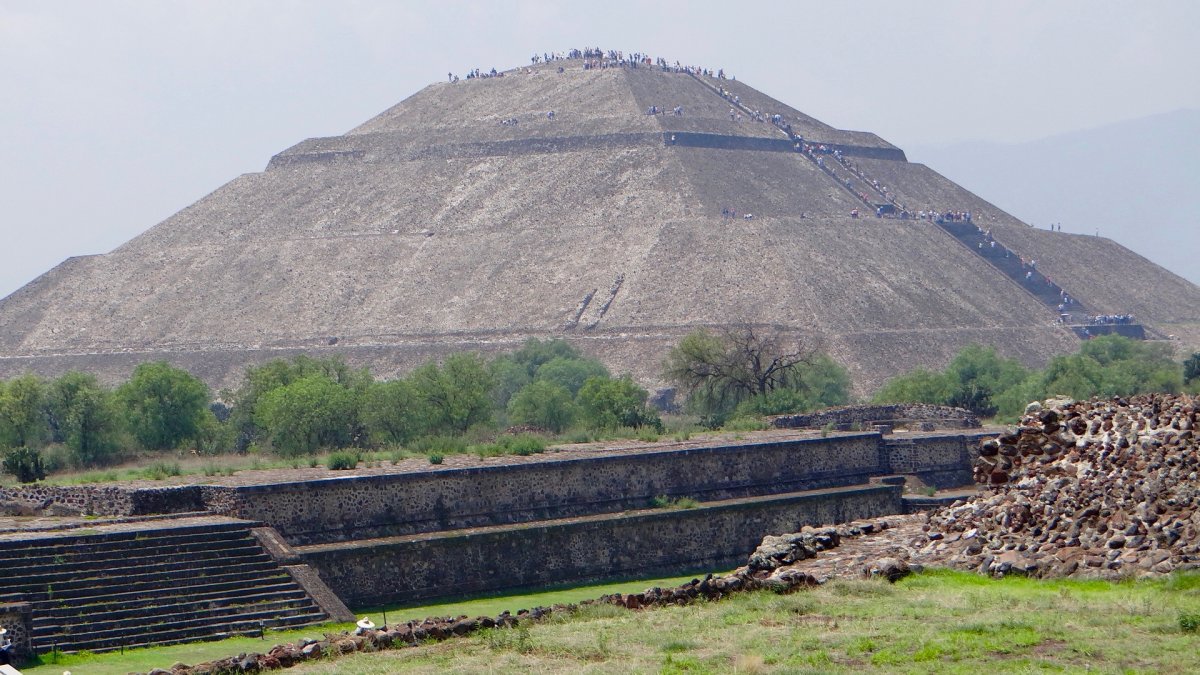 Dozens of people bravely climb the Pyramid of the Sun.