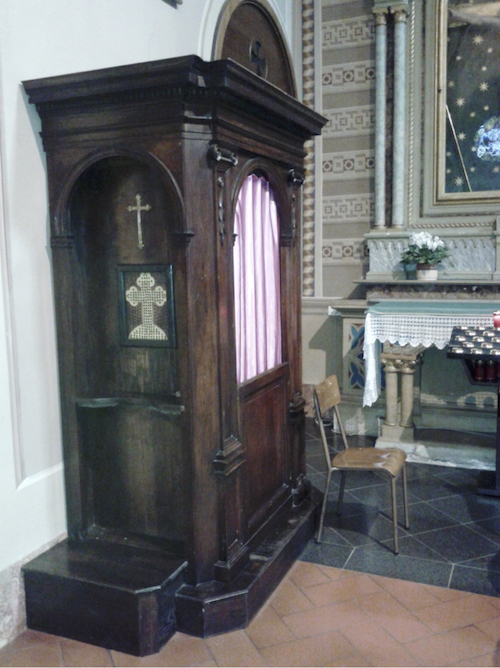 Confessional in the parish church of Abbadia Lariana in Lombardy, Italy.