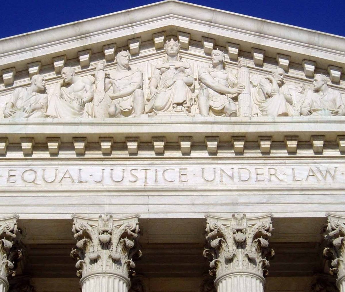 The inscription 'Equal Justice Under Law,' inspired by the Fourteenth Amendment, on the west pediment of the U.S. Supreme Court Building.