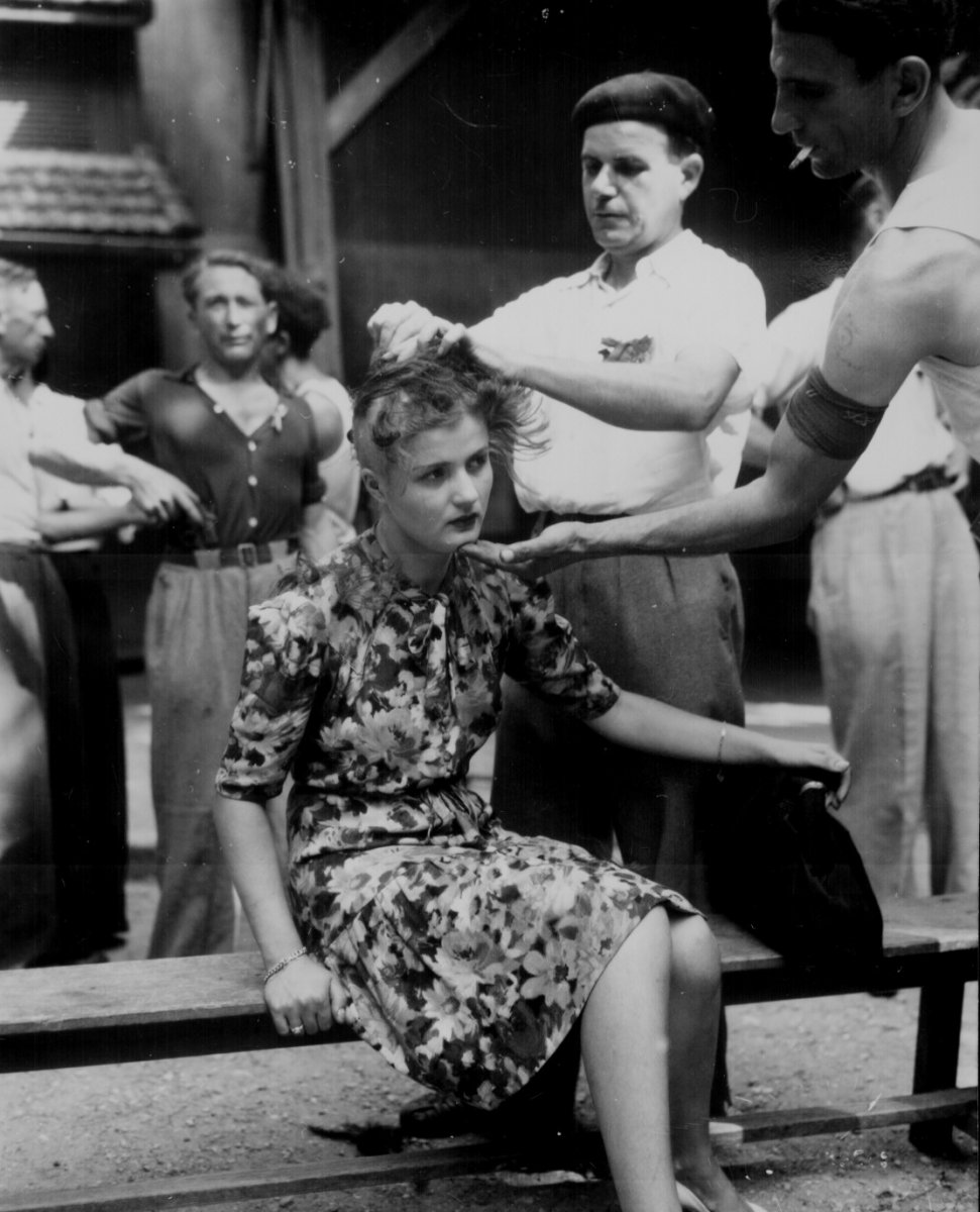 French woman forcibly has her hair cut as punishment for having relations with the Germans.