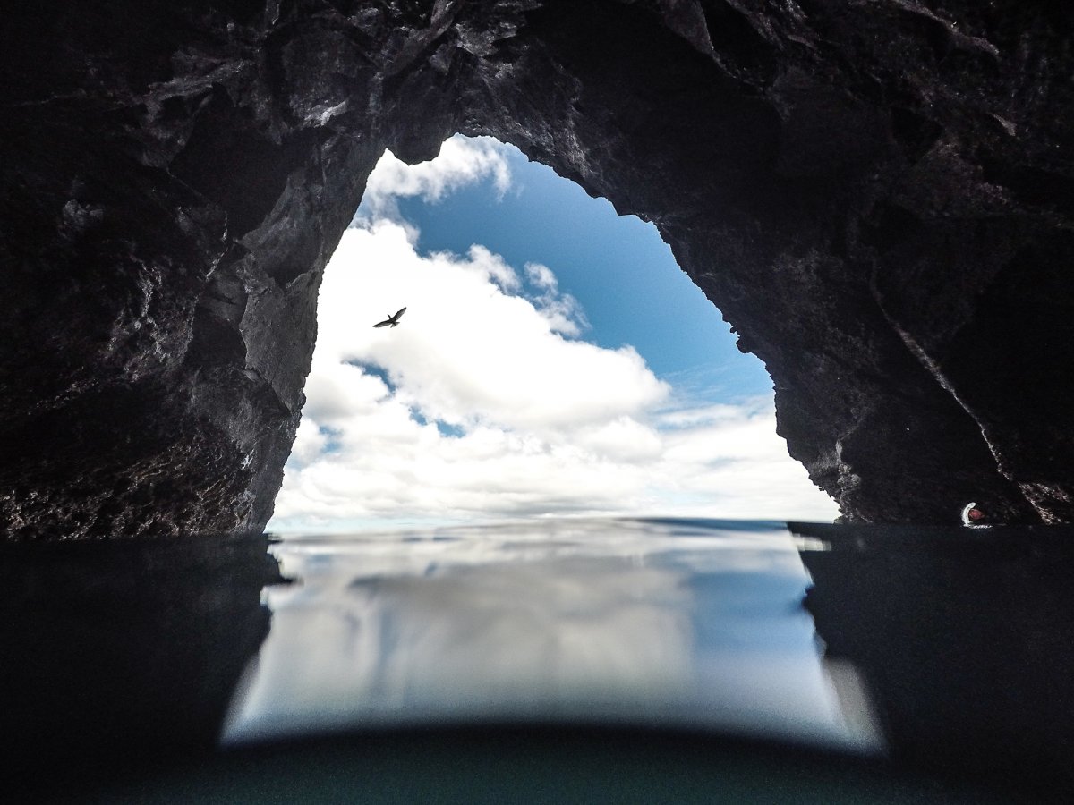 View of the Pacific Ocean through a cave.