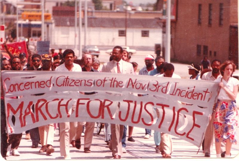 Demonstrators protest the judicial proceedings against suspected White Power activists following the Greensboro massacre.