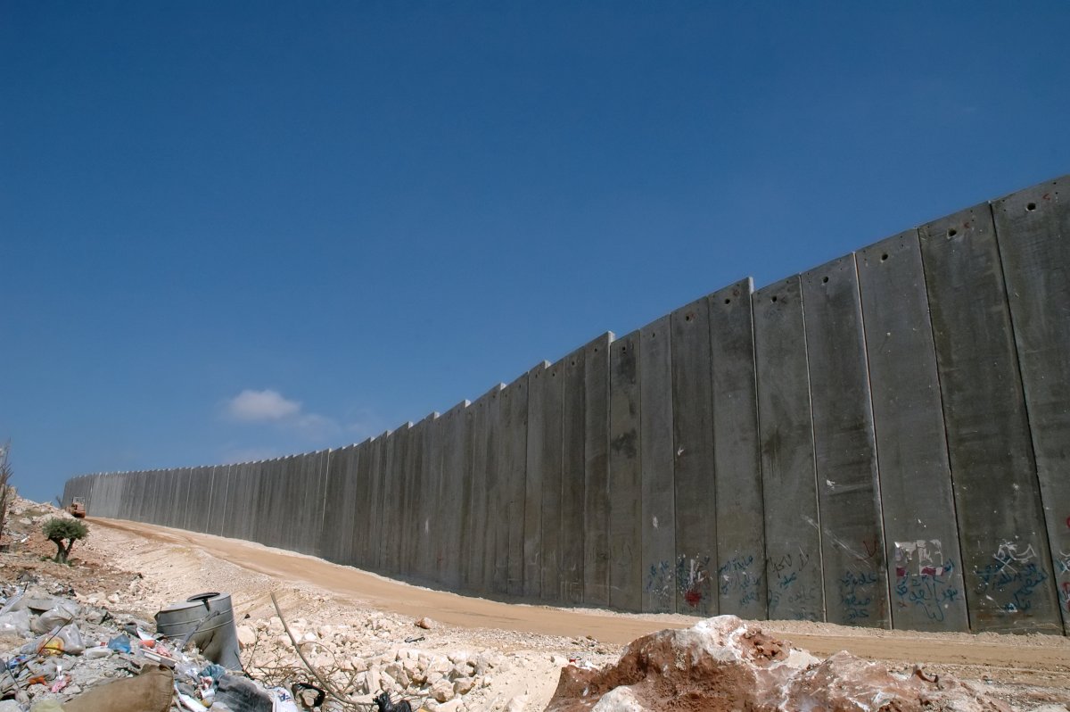 The West Bank Barrier’s construction style is often compared to the Berlin Wall but it serves a much different purpose.