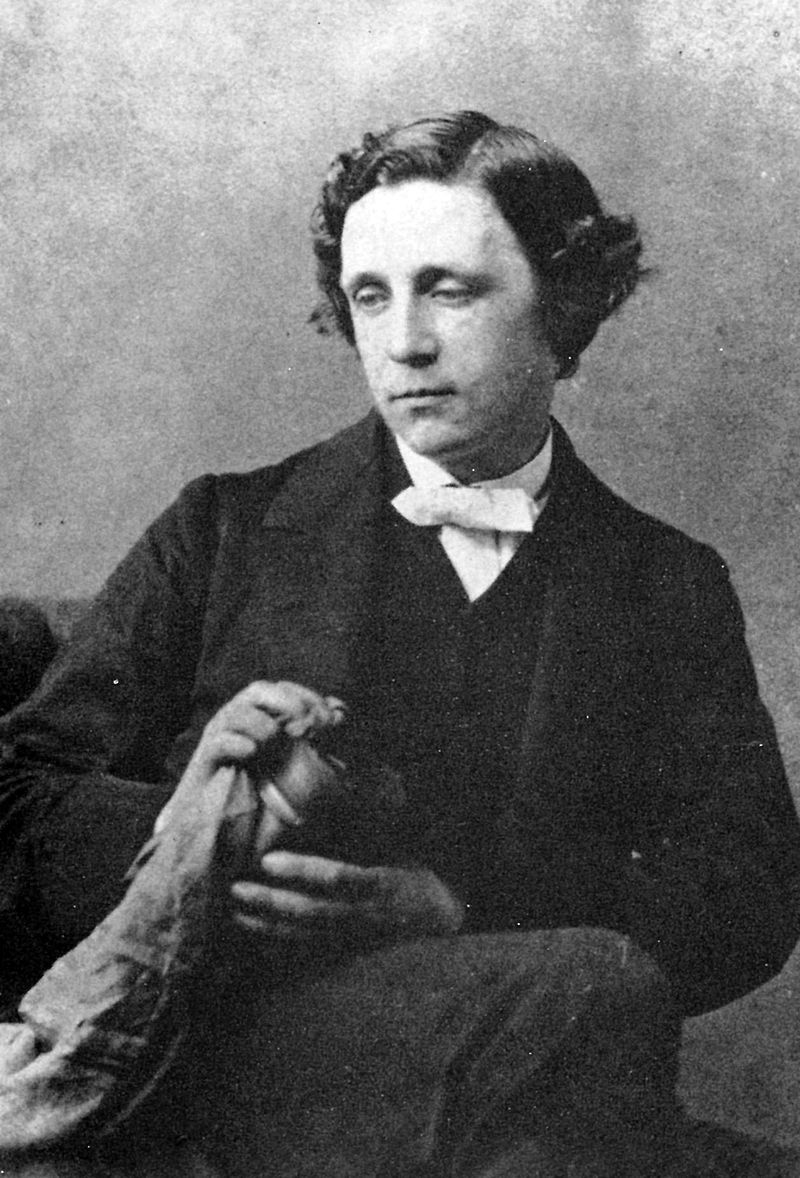 Lewis Carroll posing with a lens in 1863.