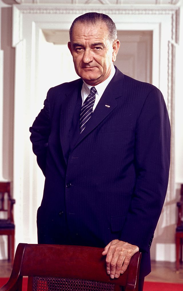 Photograph of President Lyndon B. Johnson in the Oval Office.