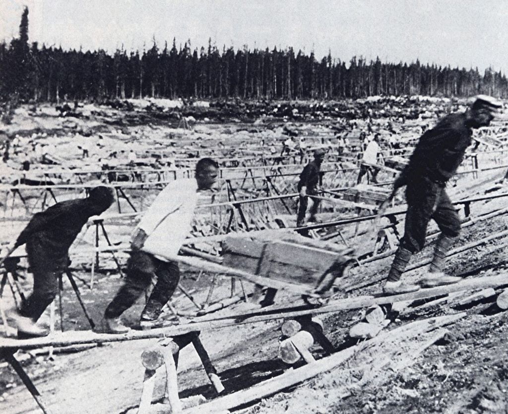 Gulag prisoners work to build a canal connecting the White Sea in the Arctic Ocean with Lake Onega.