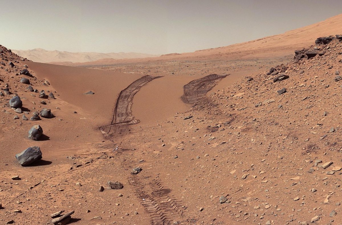 The Mars explorer Curiosity's view back at its own tracks after crossing a sand dune.