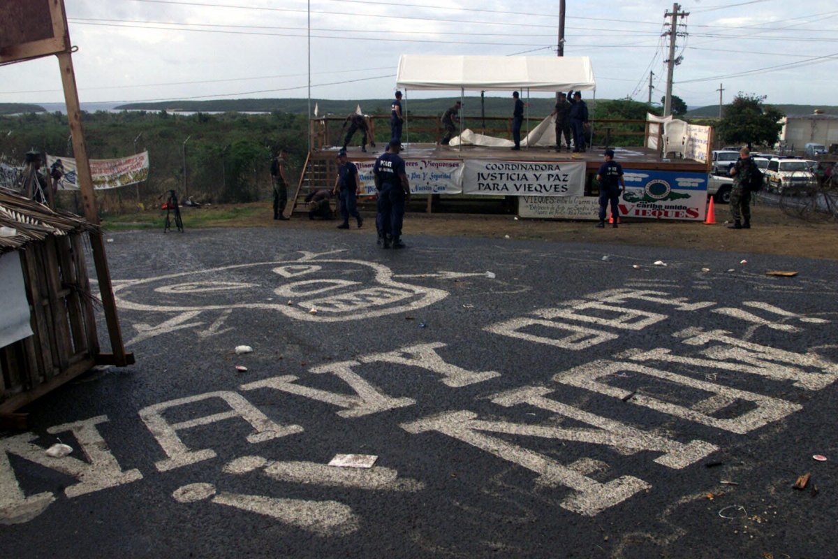 U.S. Military and Department of Justice agents dismantle a site at the Vieques Naval Training Range.