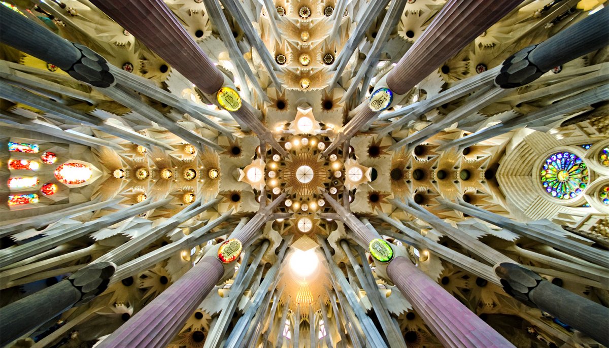 A view looking up at the roof of the nave inside the Sagrada Familia.