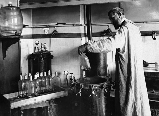 Louis Pasteur photographed working within his laboratory, undated.
