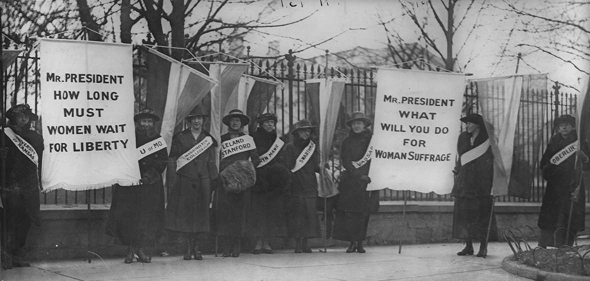 Women suffragists picket in front of the White House.