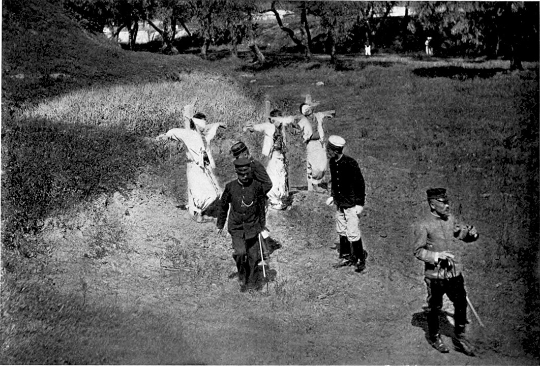 Three Koreans shot for pulling up rails as a protest against seizure of land.