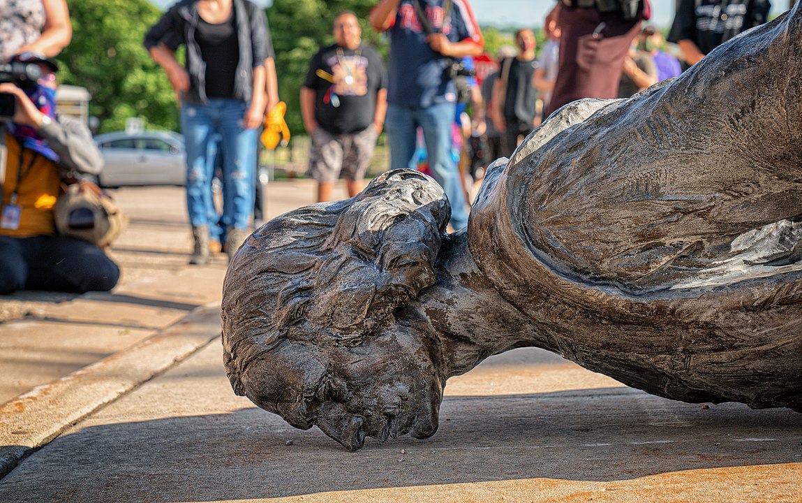 A statue of Christopher Columbus lays toppled outside the Minnesota State Capitol in June 2020 during the George Floyd protests.