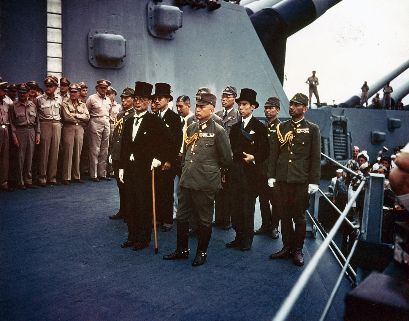 Representatives of the Empire of Japan stand aboard the USS Missouri.