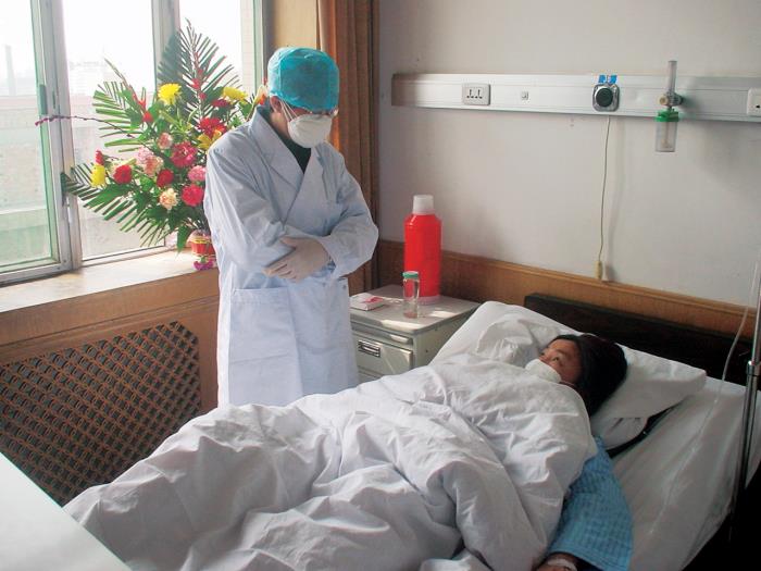 A SARS patient and their doctor in China during the 2003 outbreak.