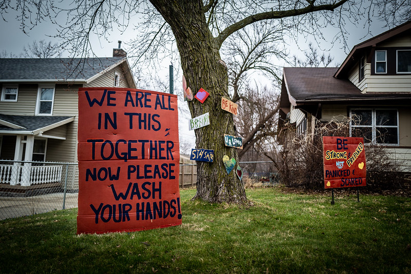 A sign in front of a Des Moines, Iowa house that says, 'We are all in this together, now please wash your hands!'