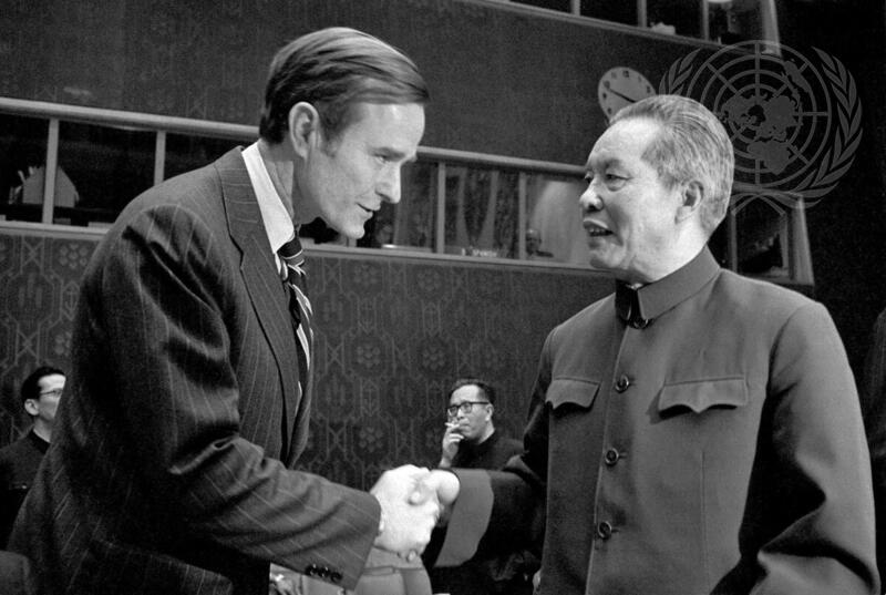 Huang Hua, Permanent Representative of China to the UN, is greeted by George H. Bush, Permanent Representative of the United States.