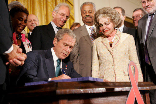President George W. Bush signs the Tom Lantos and Henry J. Hyde United States Global Leadership Against HIV/AIDS, Tuberculosis and Malaria Reauthorization Act of 2008.