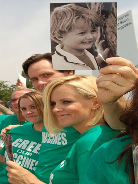 Actors Jenny McCarthy and Jim Carrey, holding a photo of McCarthy’s autistic son, at a 2008 anti-vaccination rally in Washington, D.C.