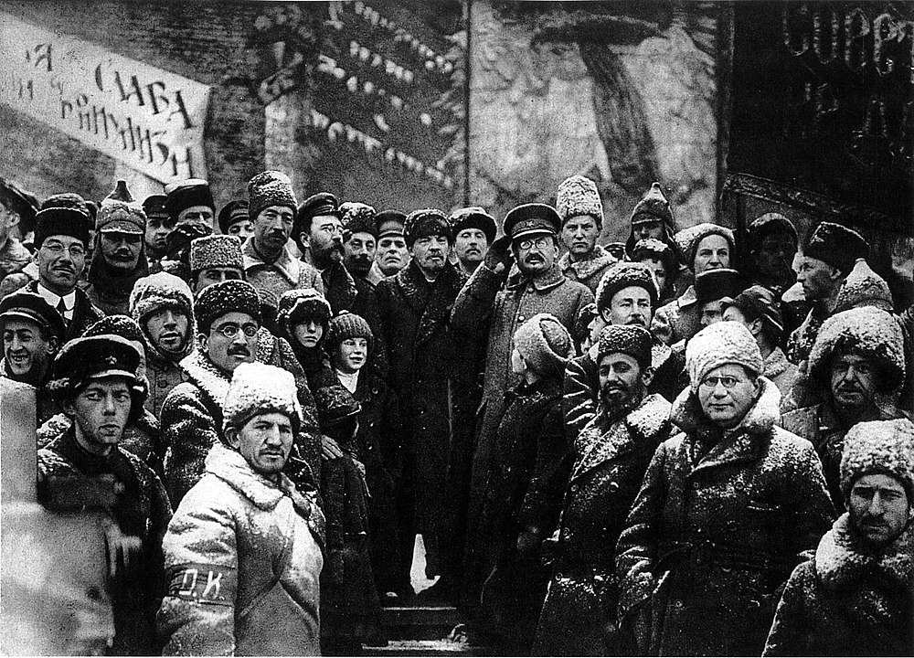 Lenin, Trotsky, and Kamenev celebrating the second anniversary of the October Revolution.