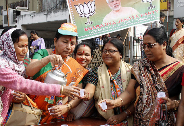 BJP worker distributing 'Modi Chai' to supporters in Guwahati, Assam, India, before 2014 General Election