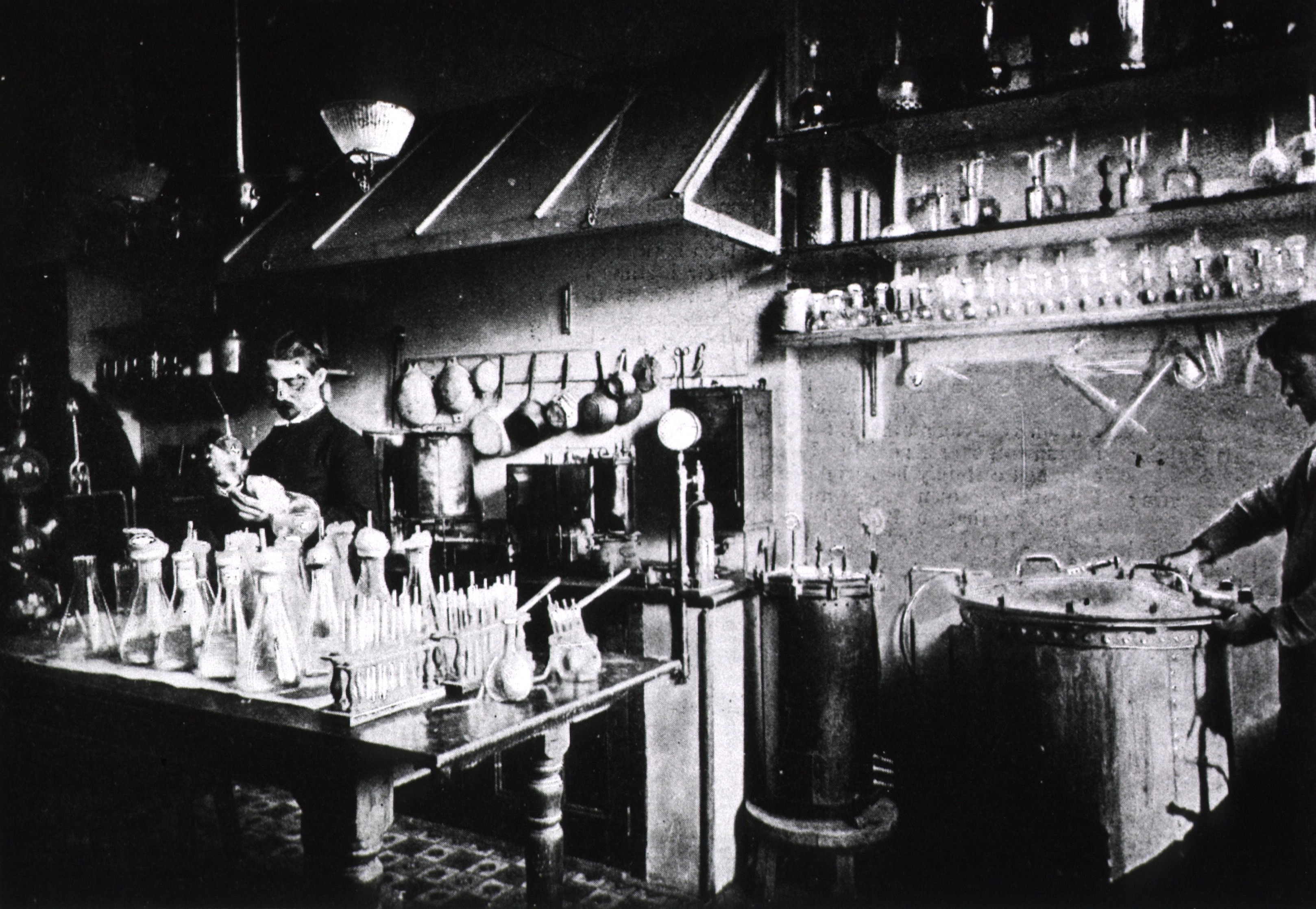 Laboratory worker in 1895 sterilizing chicken broth in autoclaves at the Pasteur Institute, where diphtheria antitoxin was made.