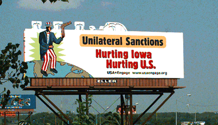 A 1999 USA*Engage sponsored billboard meant to capture the attention of campaigning presidential candidates in Des Moines, Iowa. The image features Uncle Sam throwing a boomerang, with the caption 'Unilateral Sanctions Hurting Iowa Hurting U.S.'