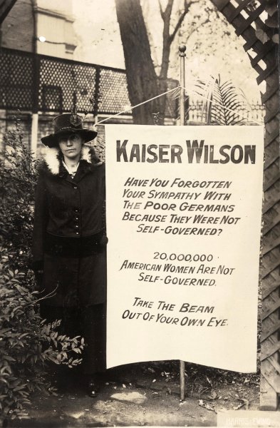 Virginia Arnold poses with the 'Kaiser Wilson' banner.