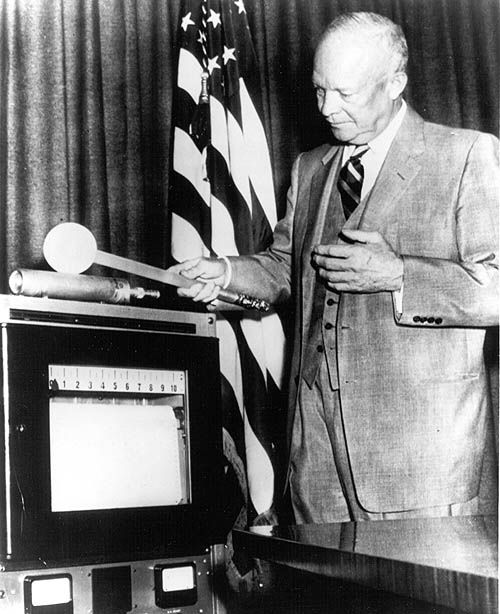 President Dwight David Eisenhower waved a ceremonial 'neutron wand' over a neutron counter.