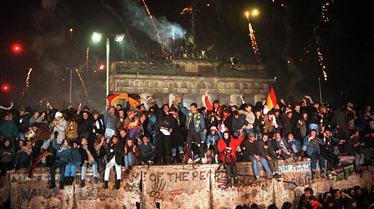 Residents of Berlin celebrate as the Berlin Wall falls, 1989.