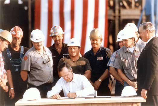 President George H. W. Bush signs the Energy Policy Act of 1992.