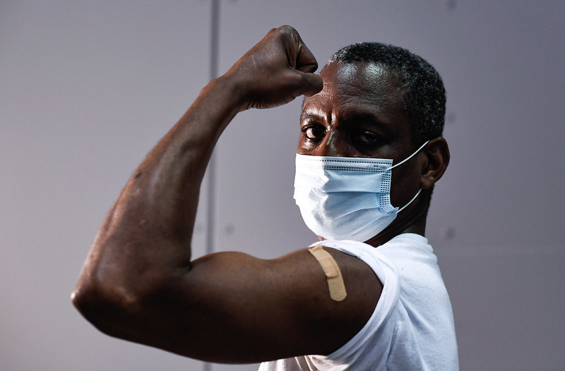 MTA of New York employee Severin Smith poses for a photograph after receiving the COVID-19 vaccine.