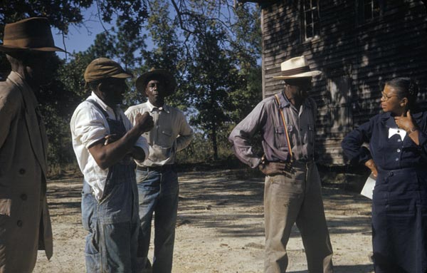 Nurse Eunice Rivers talks with test subjects of the Tuskegee Syphilis Study.