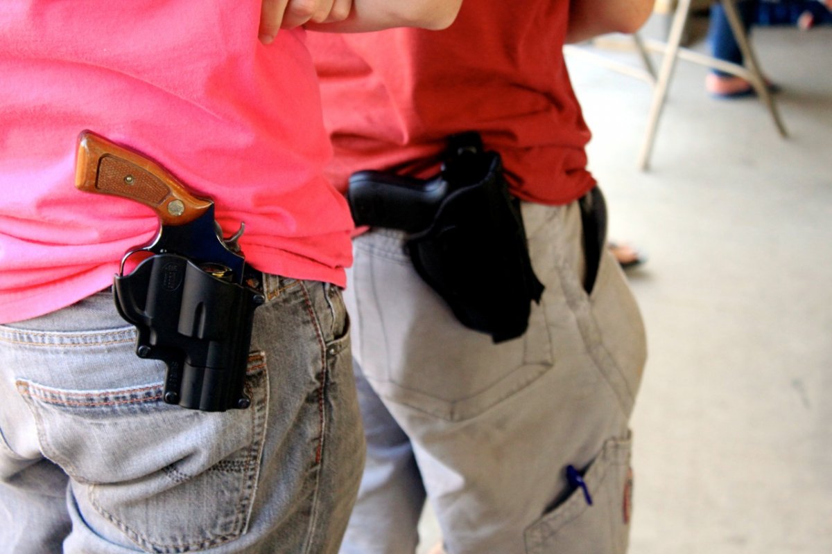 Residents of New Hampshire carrying guns.