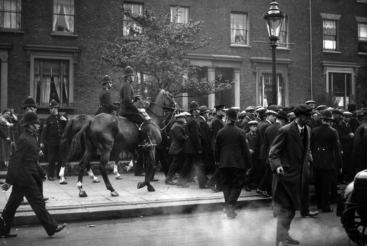 Mounted police clear demonstrators from a street in southeast London.