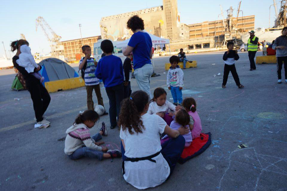 The author and friend playing with children.