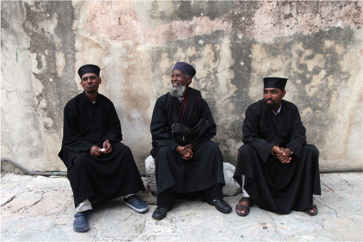 Ethiopian monks relax in the courtyard of Dier Es-Sultan monastery.