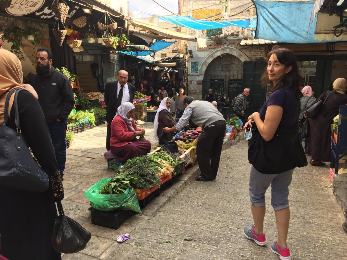 Elderly women sell produce near the Damascus Gate entrance.