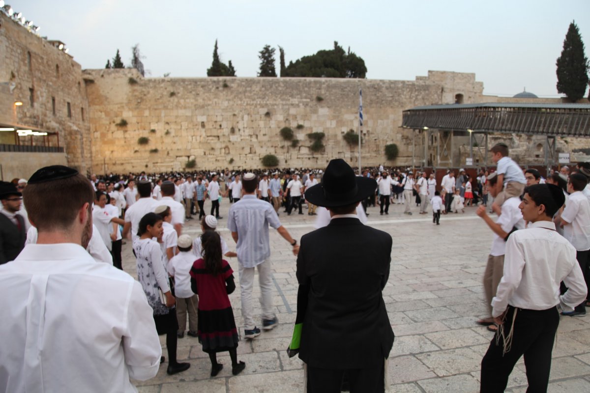 Orthodox men pray at the Western Wall on the Jewish holiday of Shavuot.