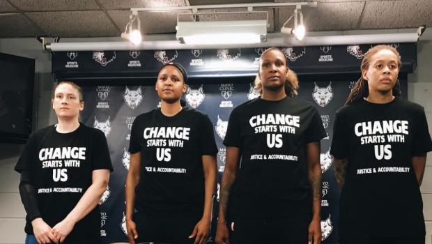 Members of the Minnesota Lynx wearing shirts protesting racism and police brutality.