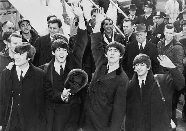 The Beatles arrive in 1964 to meet their new fans in America.