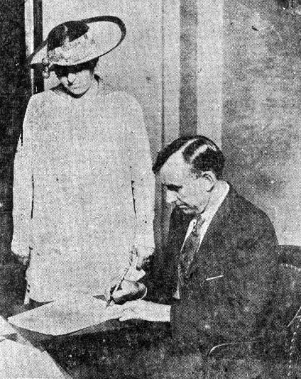 Tennessee Governor A.H. Roberts signing papers to certify Tennessee's passing of the Nineteenth Amendment.